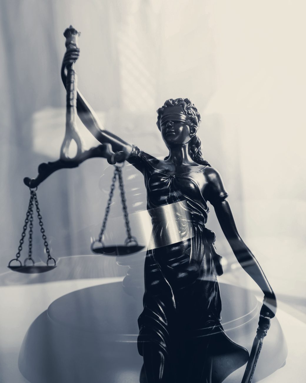 Bronze statue of Lady Justice holding the scales